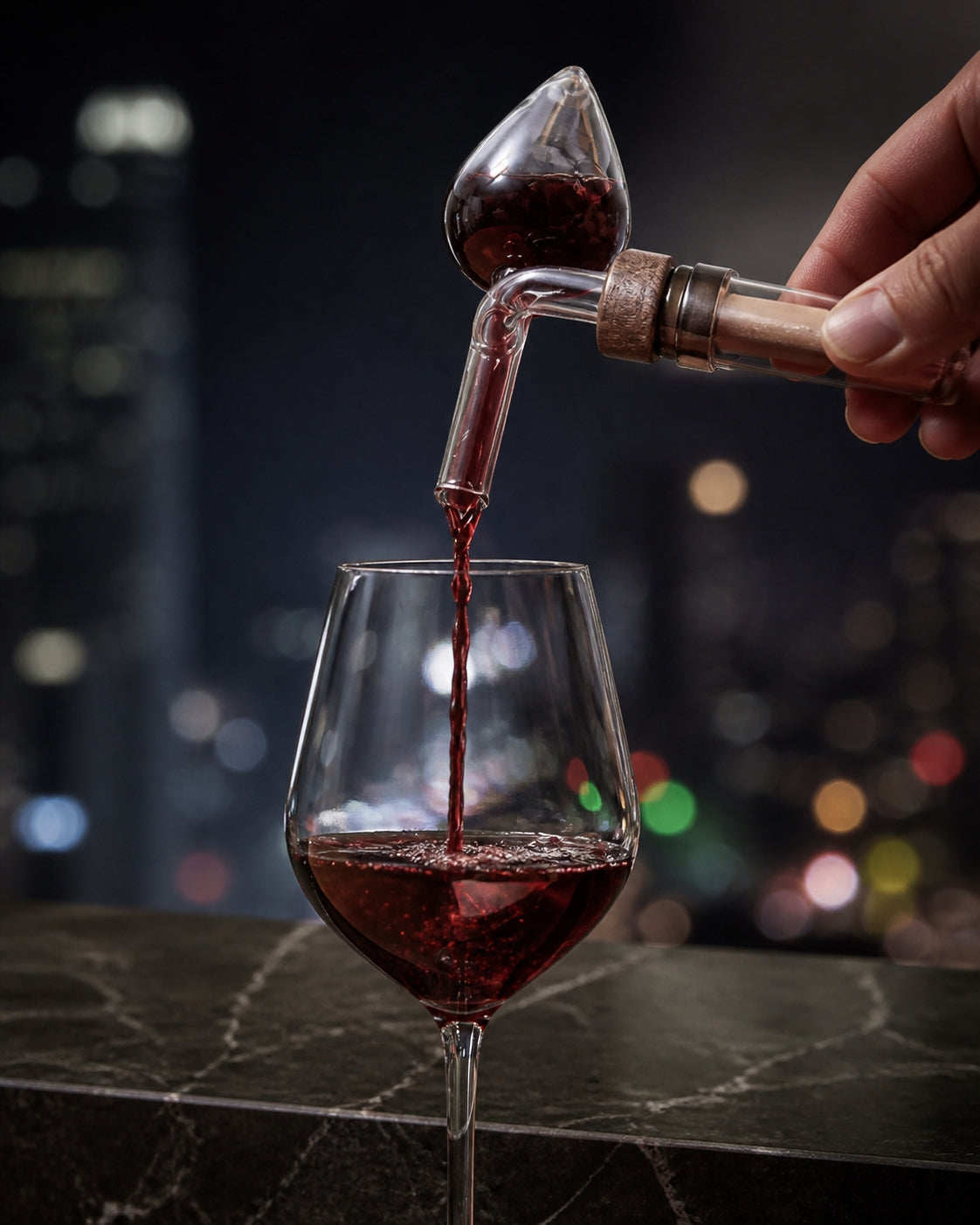 Centellino decanter pouring red wine into a glass